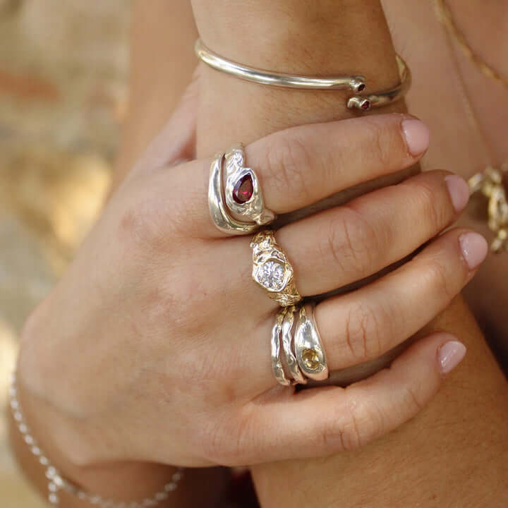 Hands with Le Mela rings